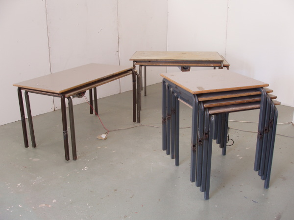 three stacks of tables
